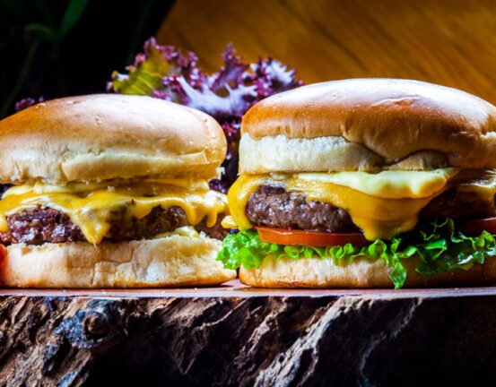 Delicious two cheeseburger on wooden board 